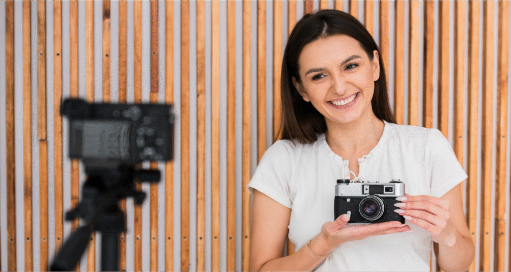 Girl holding Camera for Video Production Company